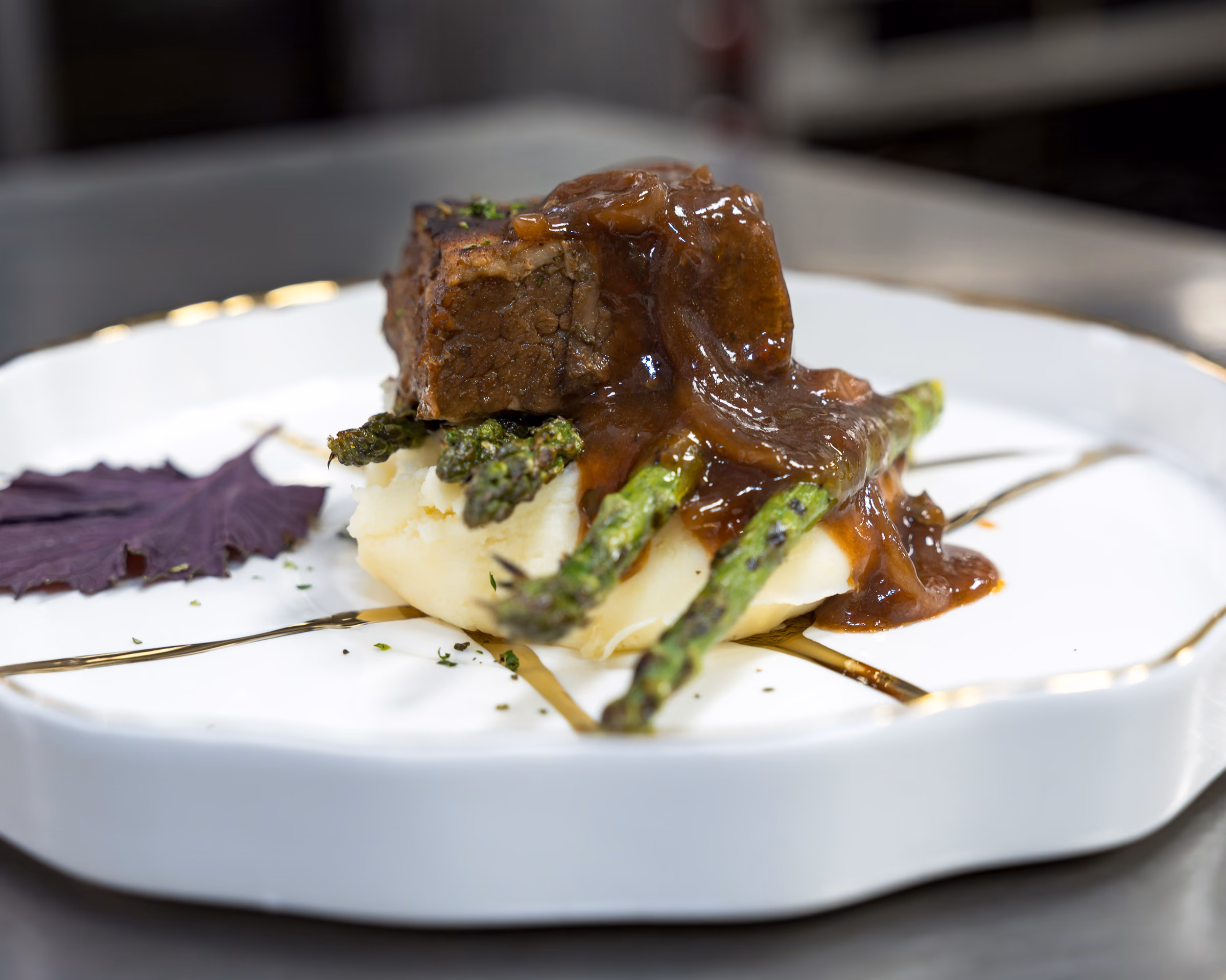 Braised short rib with asparagus over mashed potatoes