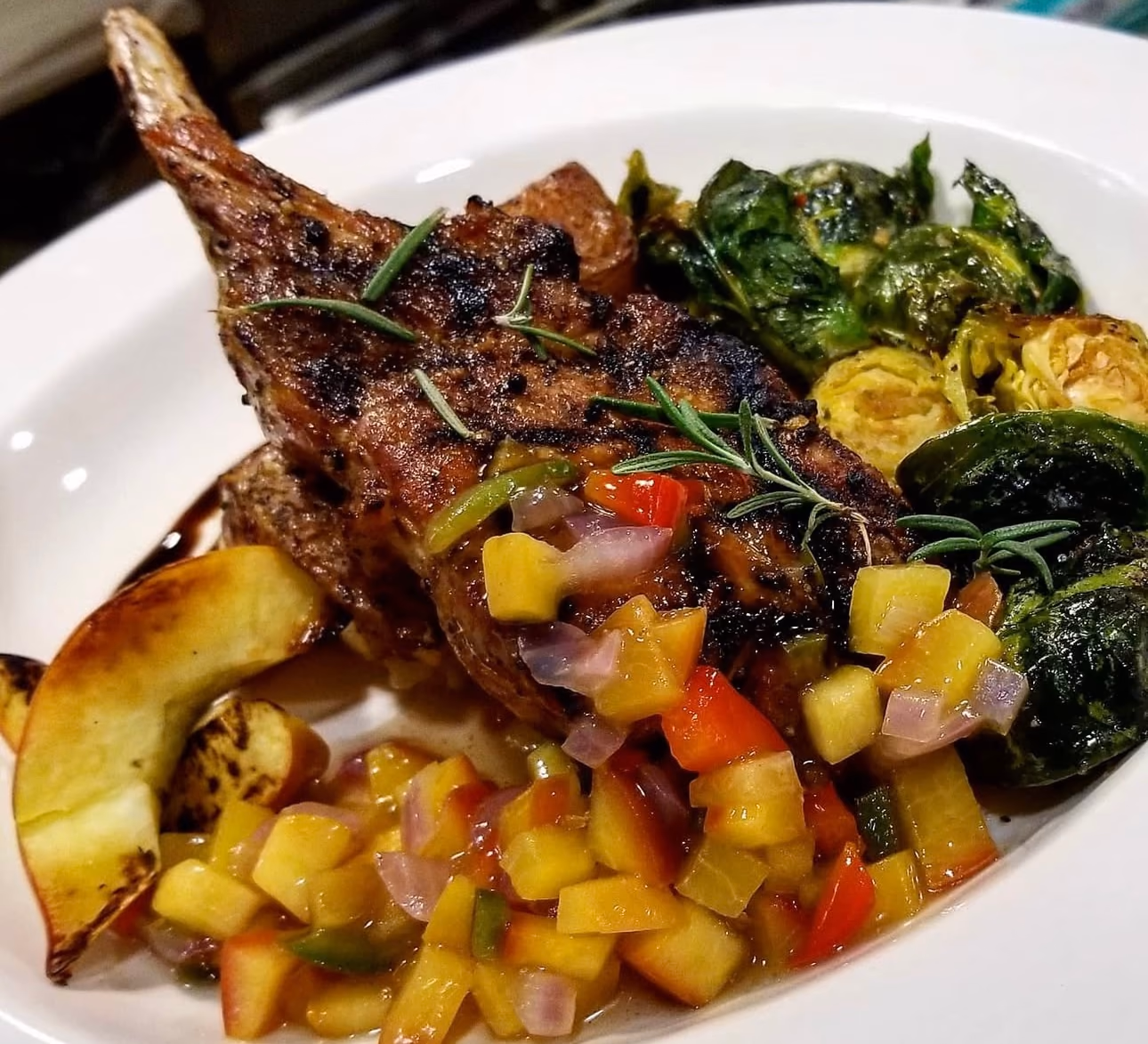 Grilled chop with mango salsa and roasted vegetables